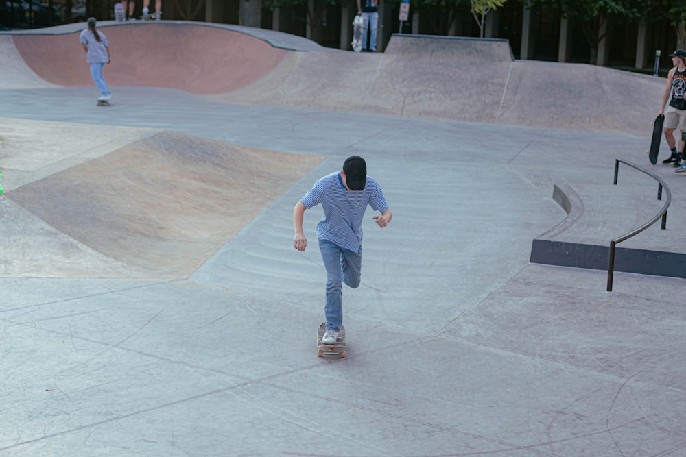 a man riding a skateboard down the side of a ramp