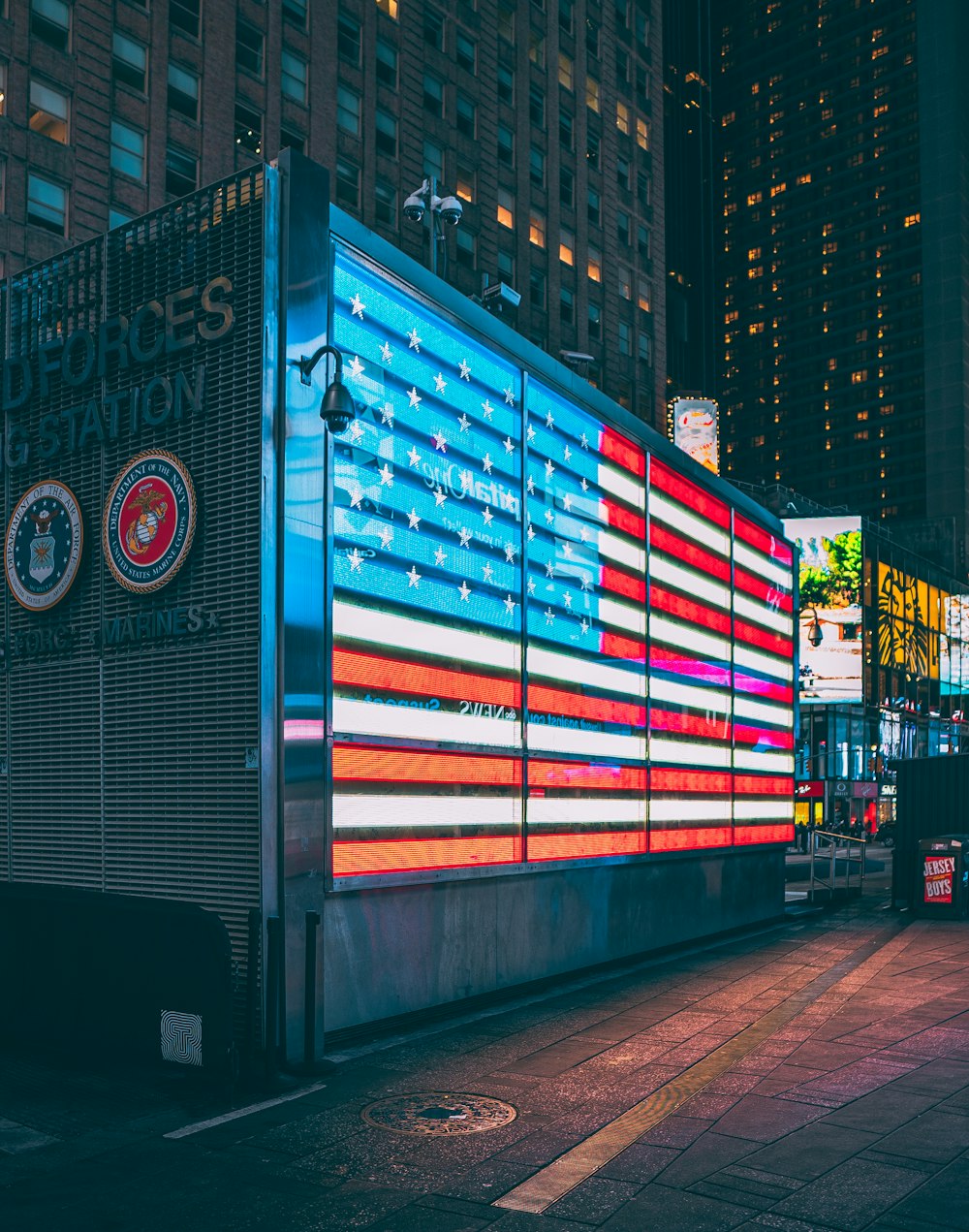 a large american flag is projected on the side of a building