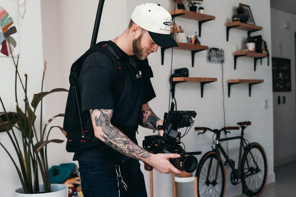 a man holding a camera in his hands