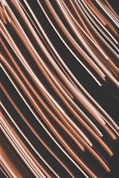 a close up of a black background with pink streaks