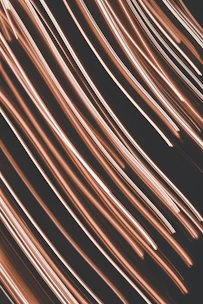 a close up of a black background with pink streaks