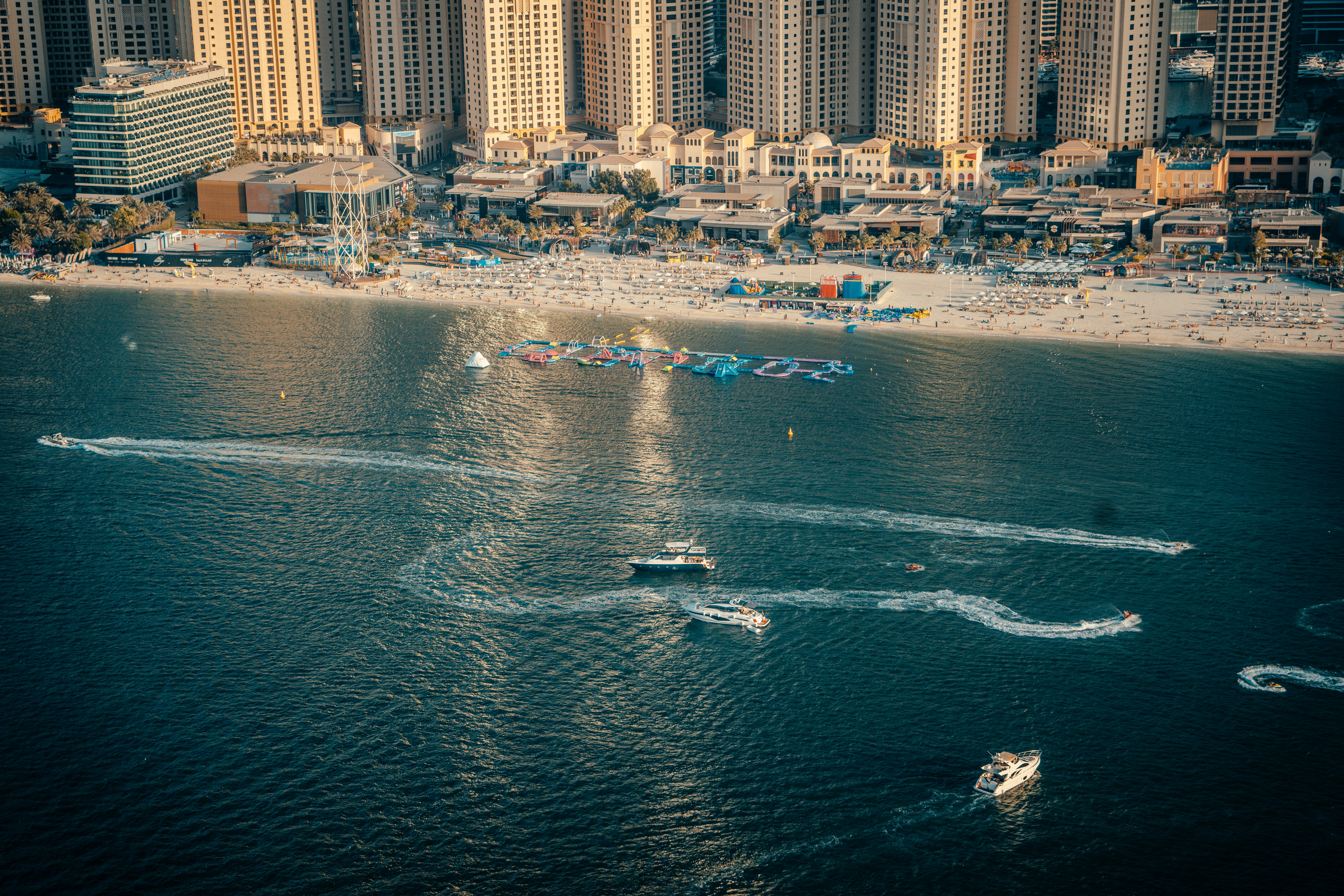 A group of boats floating on top of a body of water photo – Free Grey ...