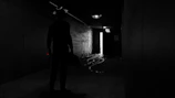 Home hallway with Shockfog device activating as a shadowy figure approaches.