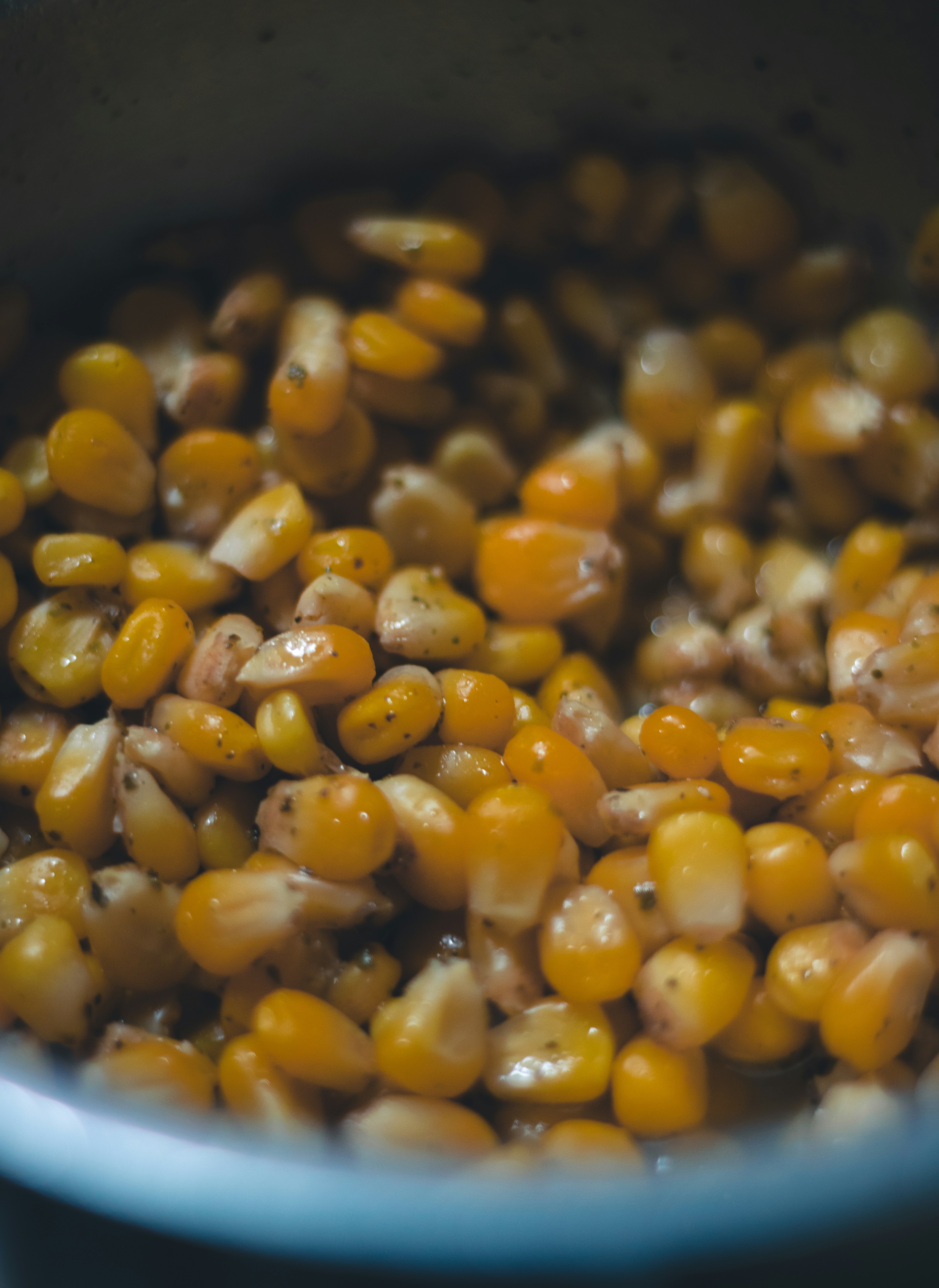a close up of a bowl of corn