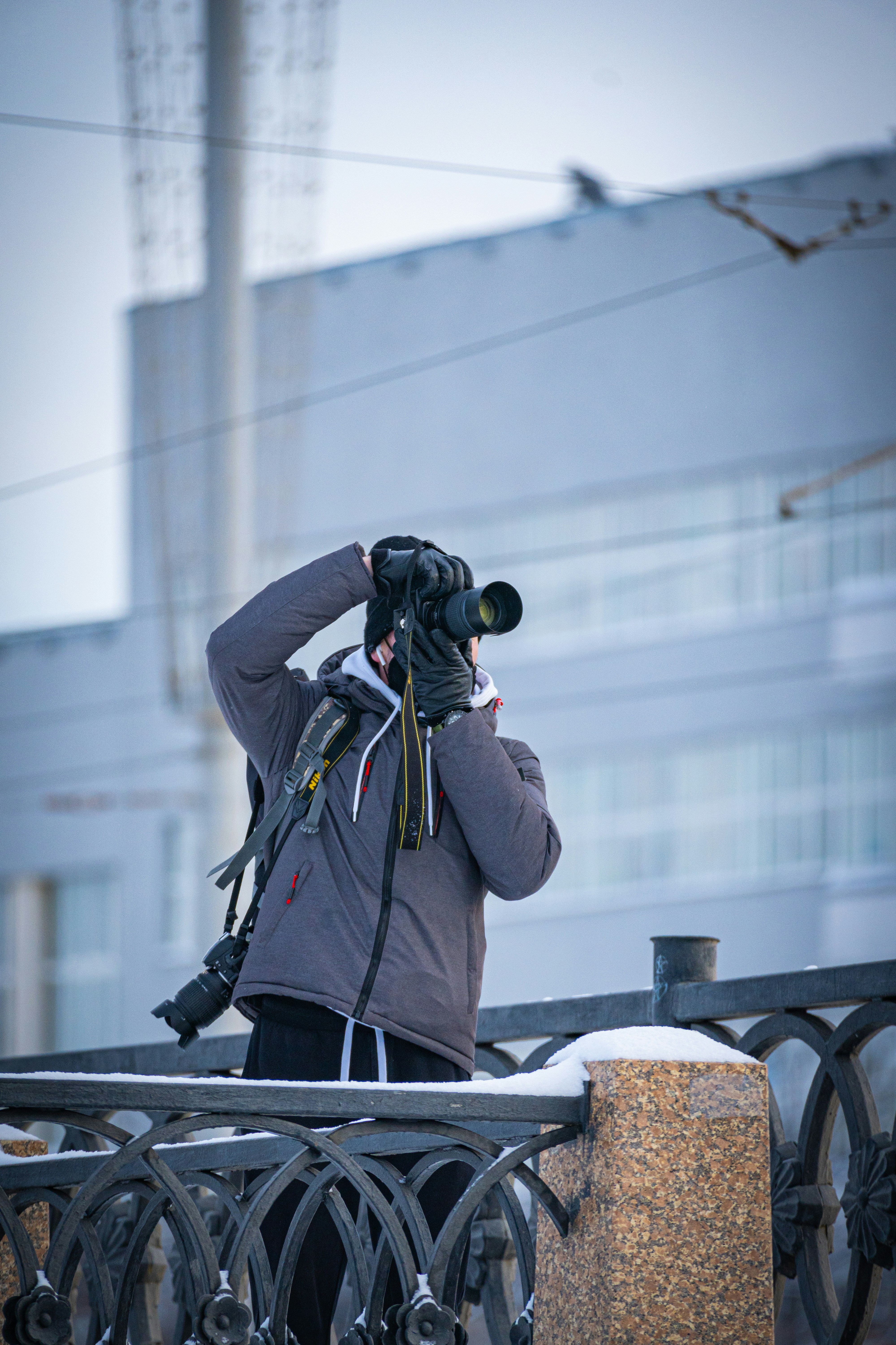 a man taking a picture of a building with a camera