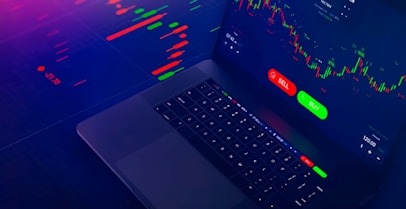 a laptop computer sitting on top of a desk