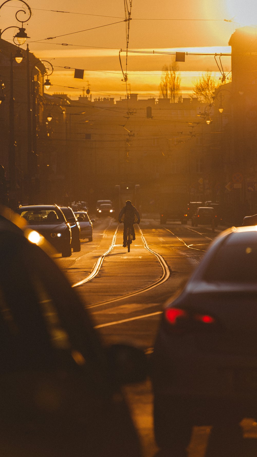 a person riding a bike on a city street