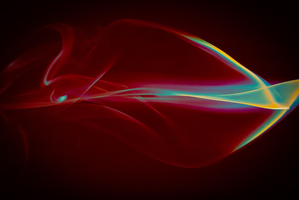 a red and blue swirl on a black background