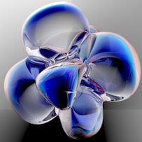 a blue and white abstract object on a black surface