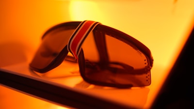 a pair of sunglasses sitting on top of a table