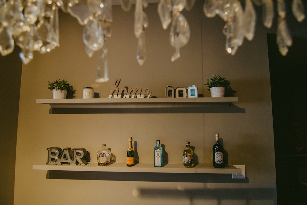 a couple of shelves filled with bottles of wine