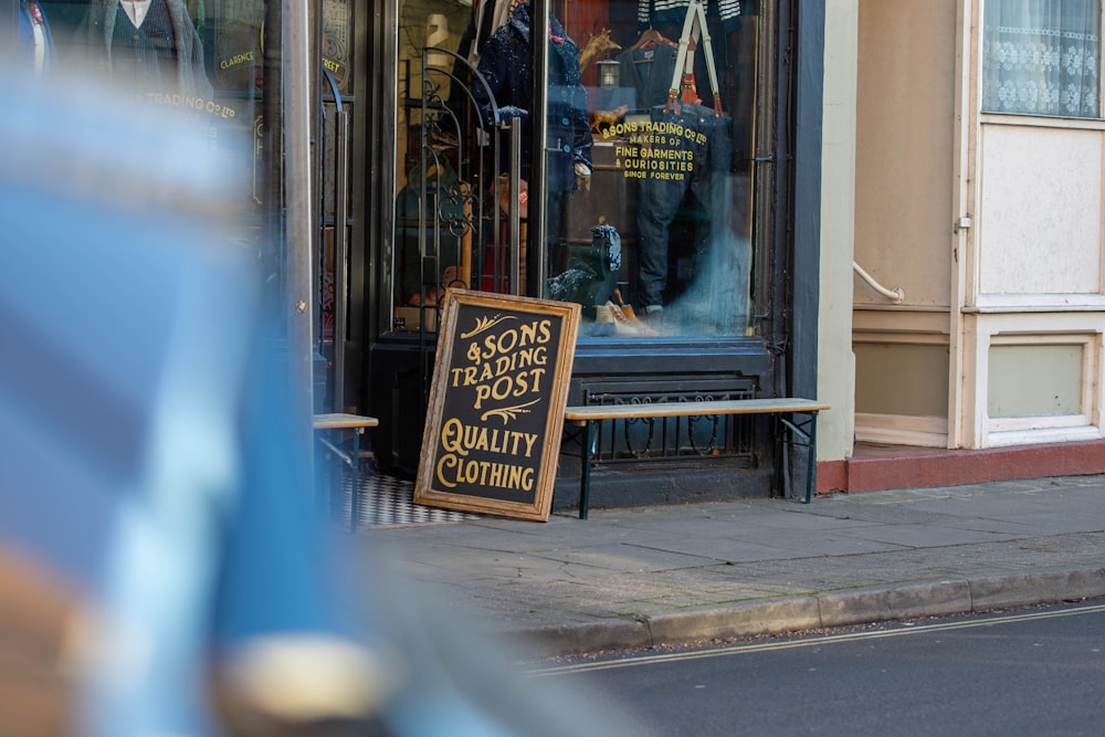 a store front with a sign in front of it