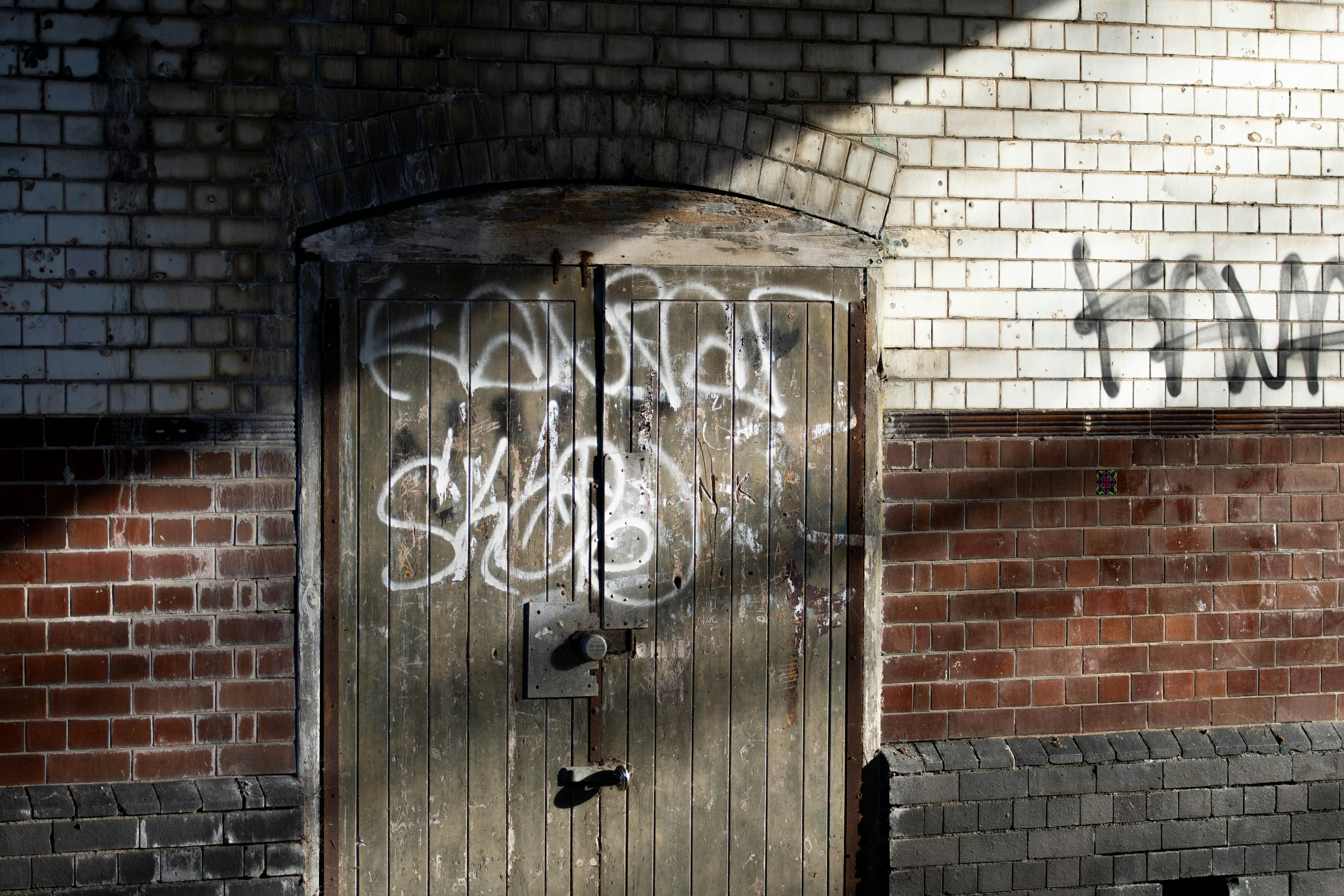graffiti on a brick wall - criminal mischief