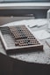 a close up of a table with an abacus, paper and glass of water