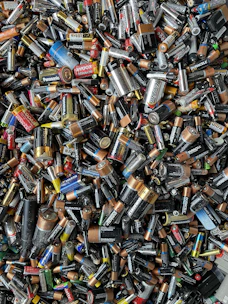 a pile of different types of batteries and batteries