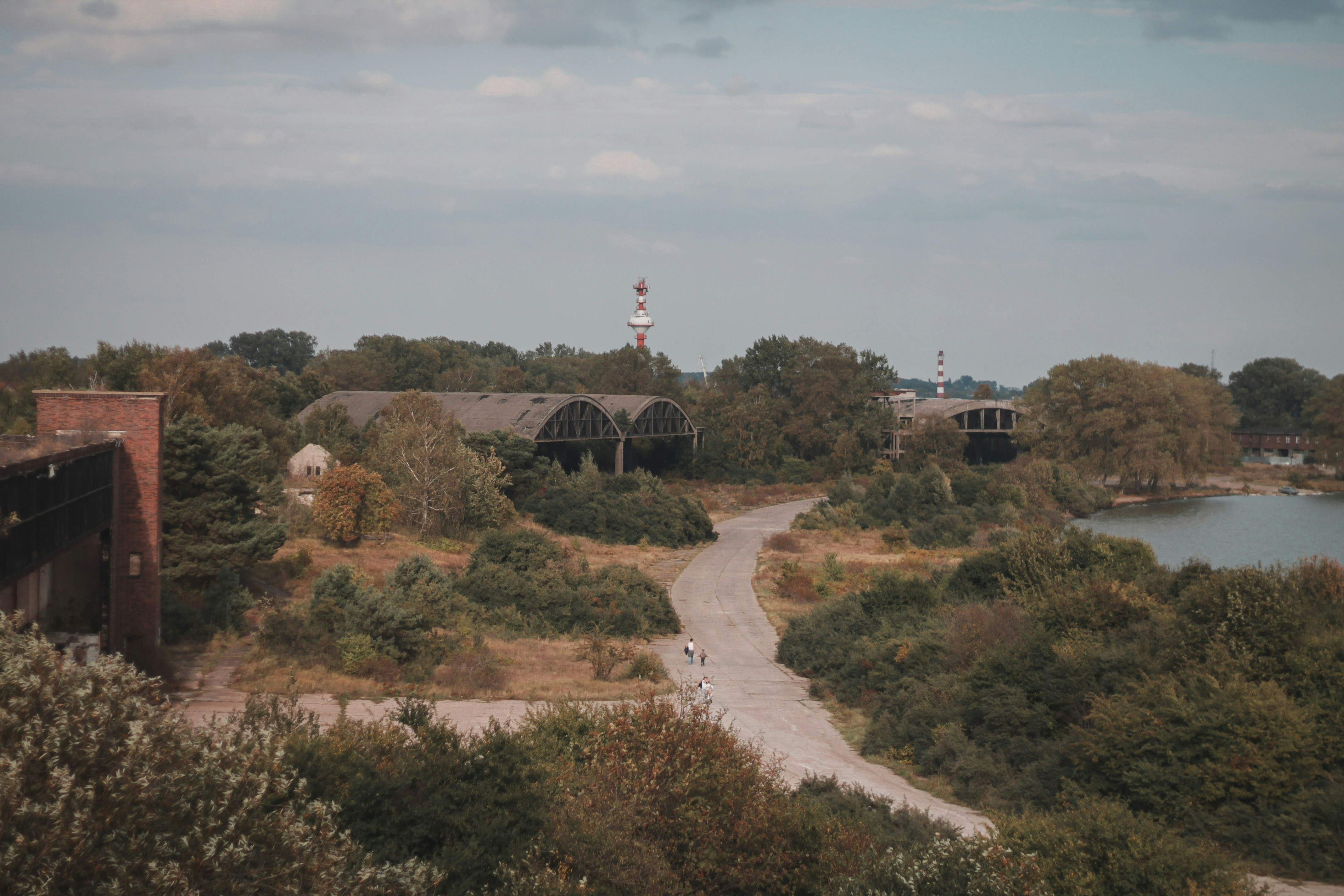 a scenic view of a lake and a building, 