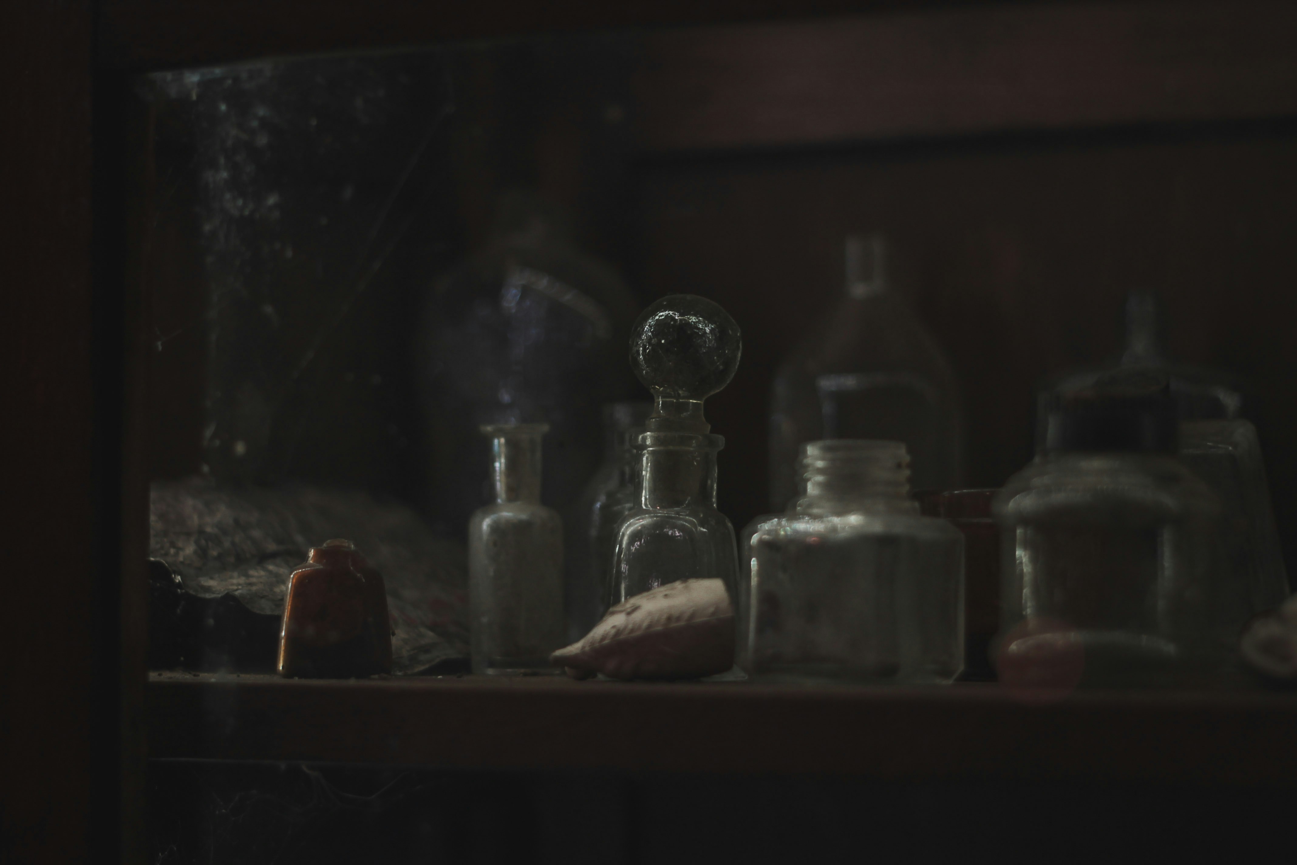 a shelf filled with bottles and other items