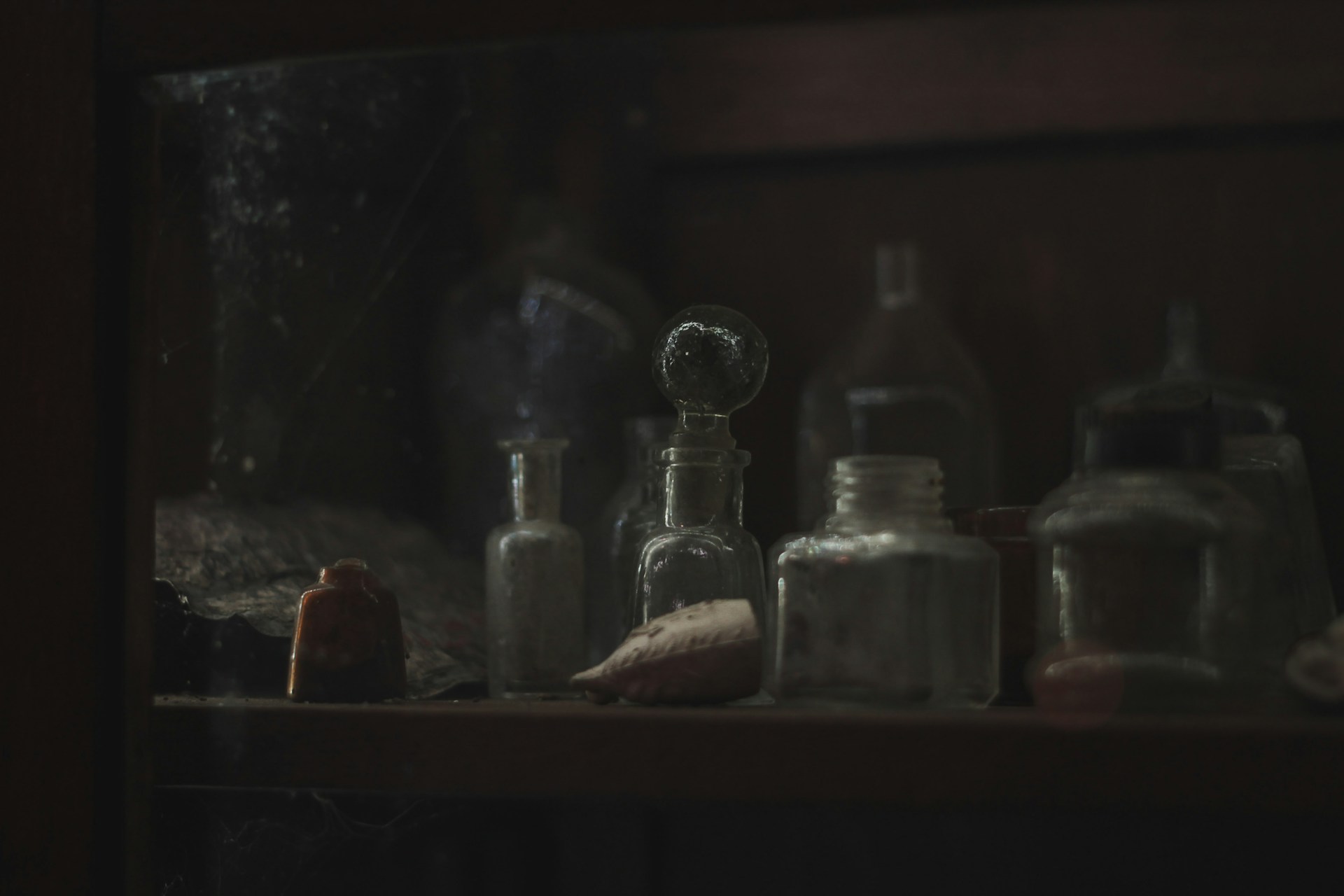 a shelf filled with bottles and other items