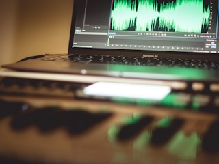 a laptop computer sitting on top of a desk