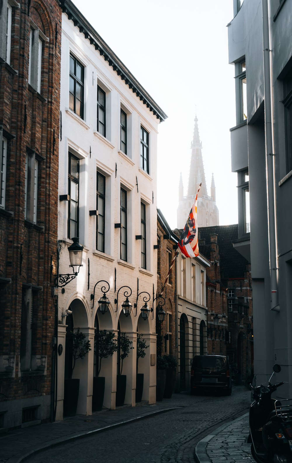 a street with buildings and a flag on it