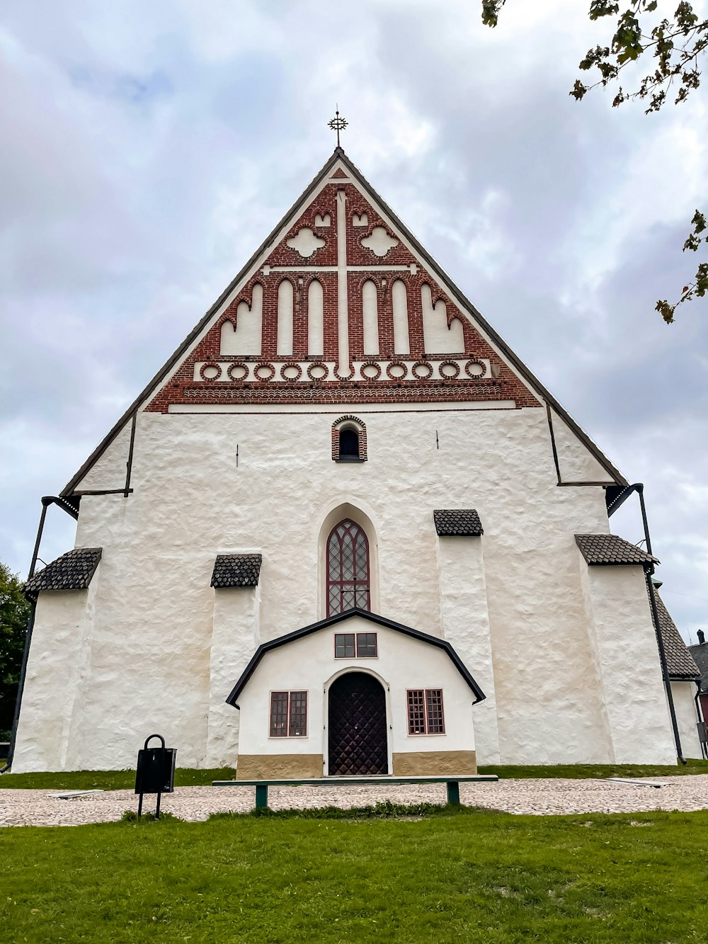 a white church with a red and white roof