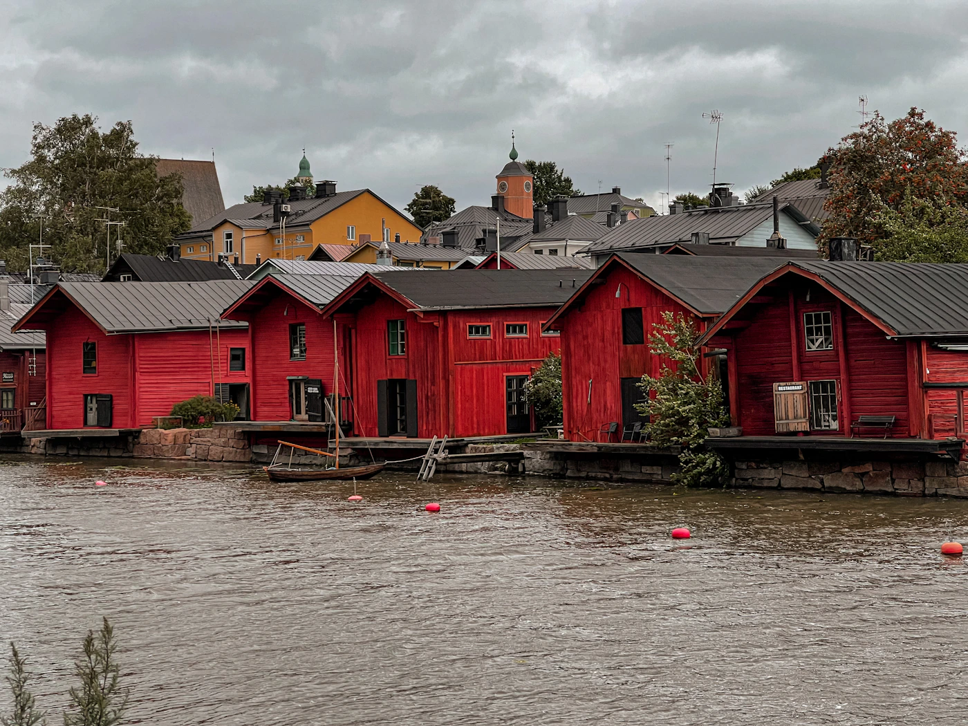 Red-ochre shore houses beside the river in Porvoo
