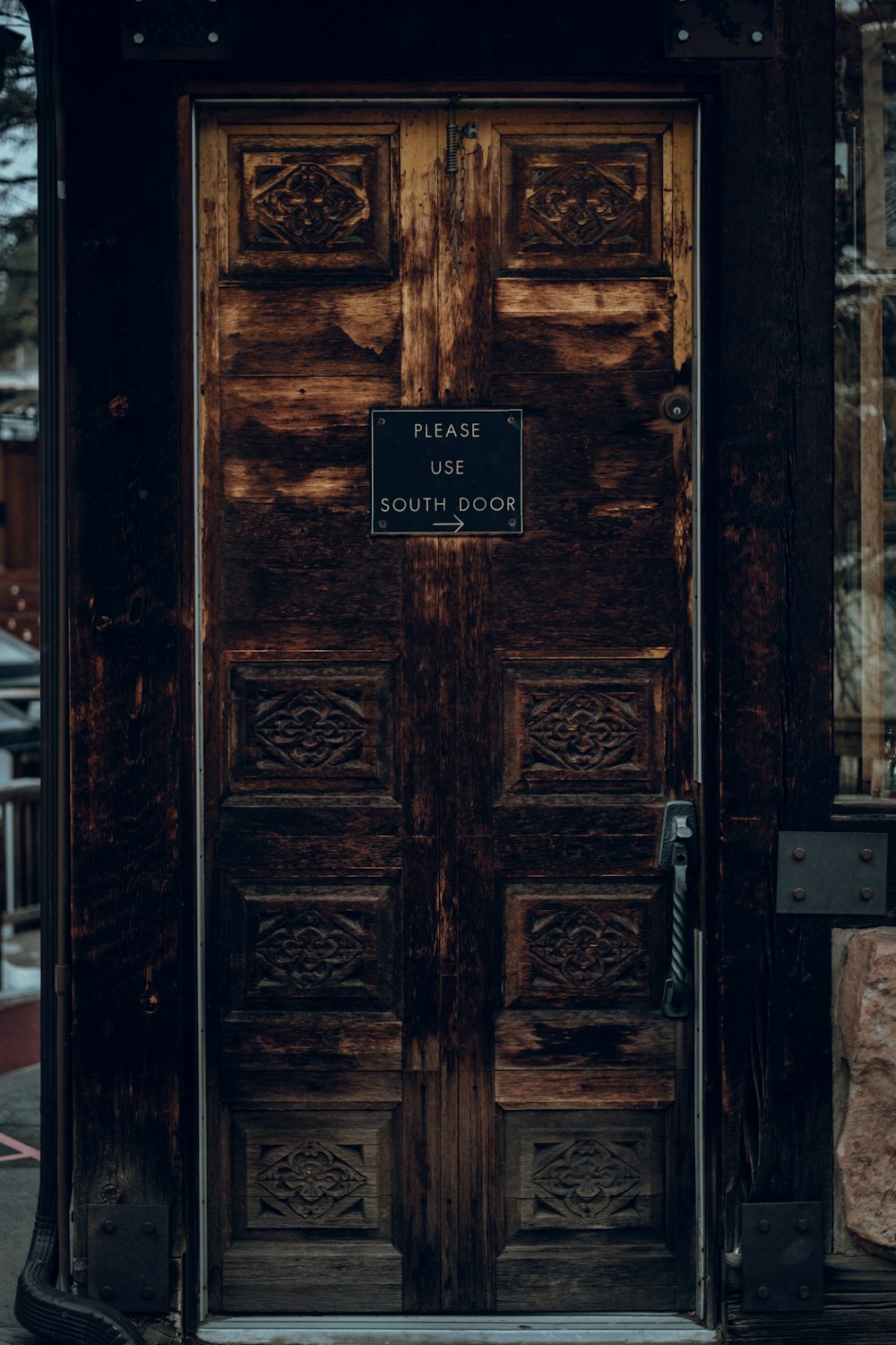 a wooden door with a sign on it