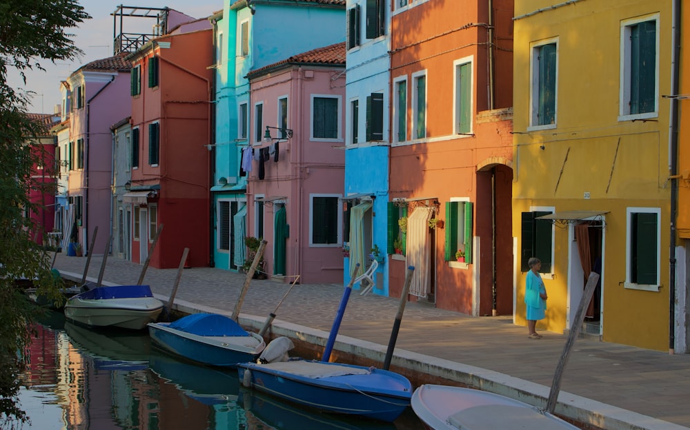 a row of colorful buildings next to a body of water