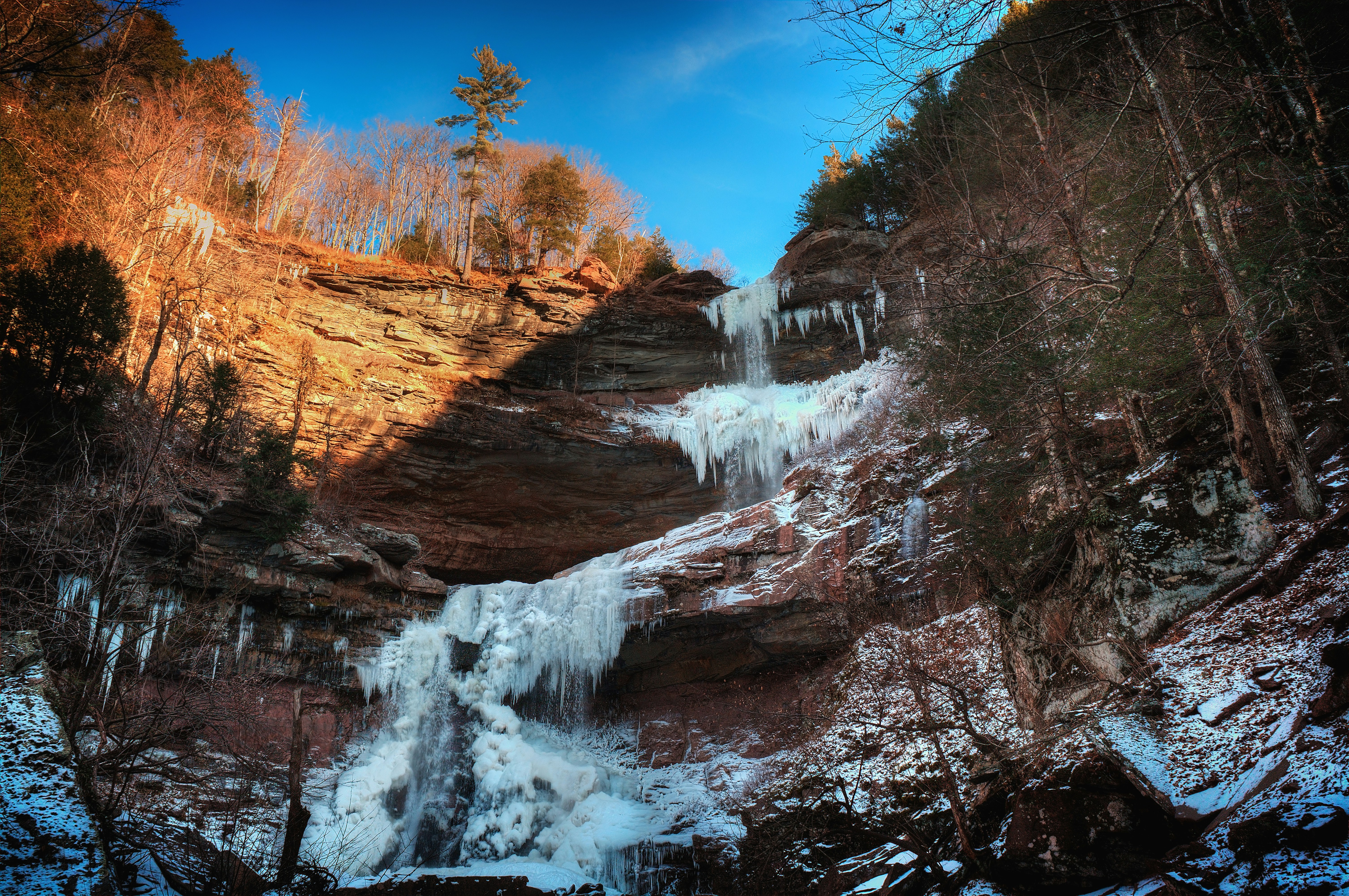 a waterfall with ice on the side of it
