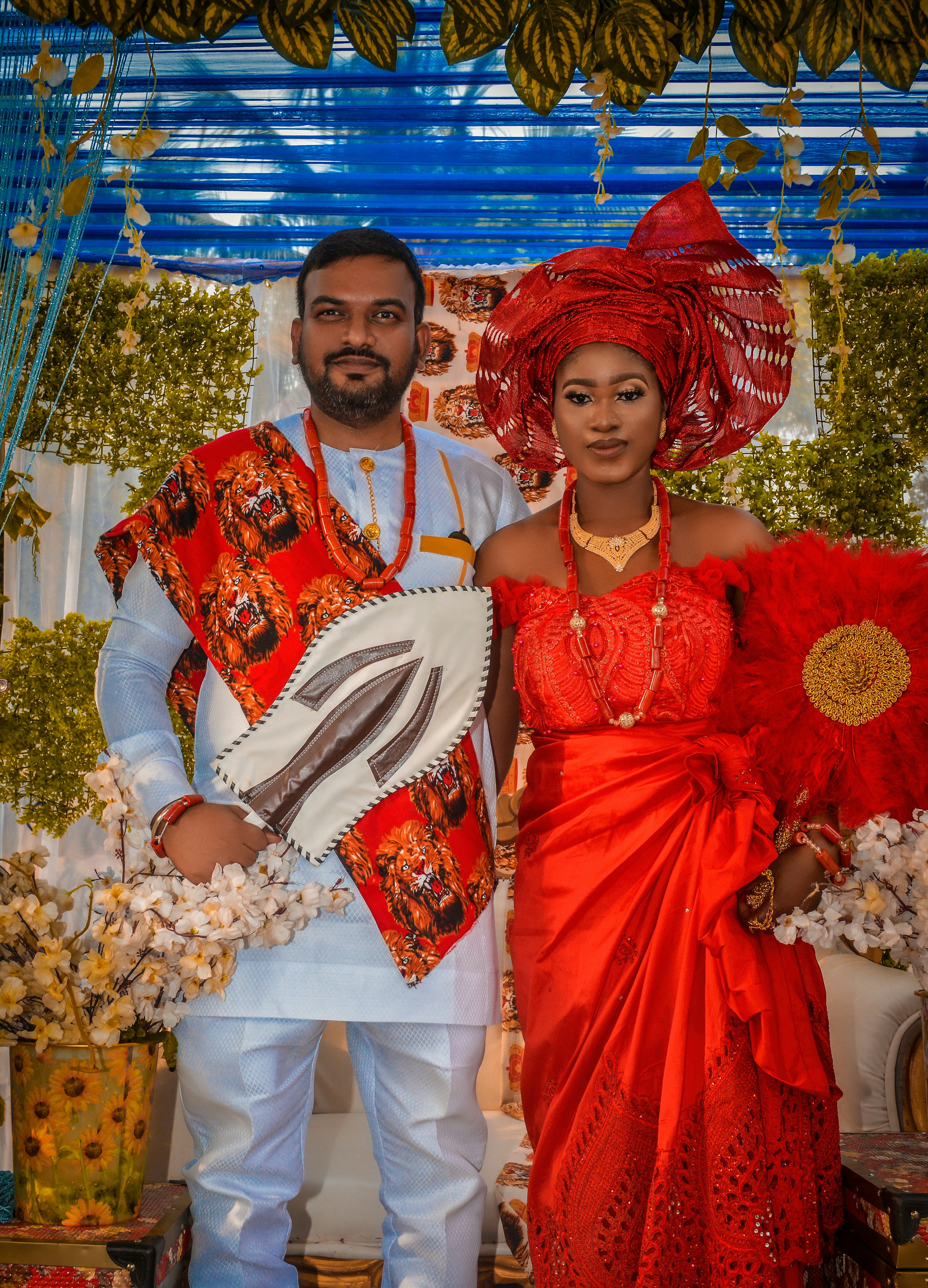 a man and a woman dressed in traditional african clothing