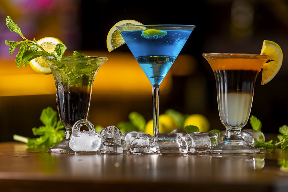 a table topped with three different types of drinks