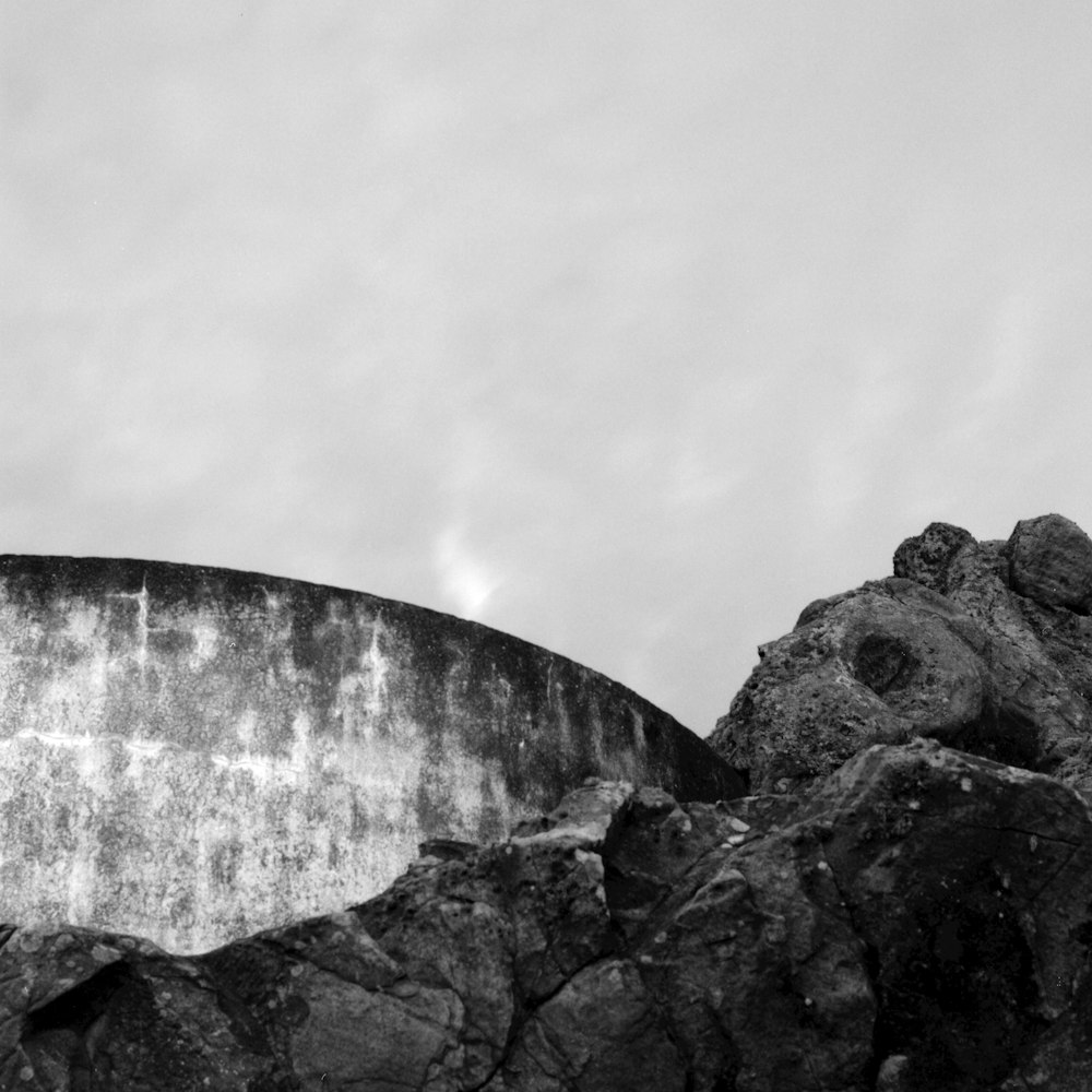 a black and white photo of a rock formation