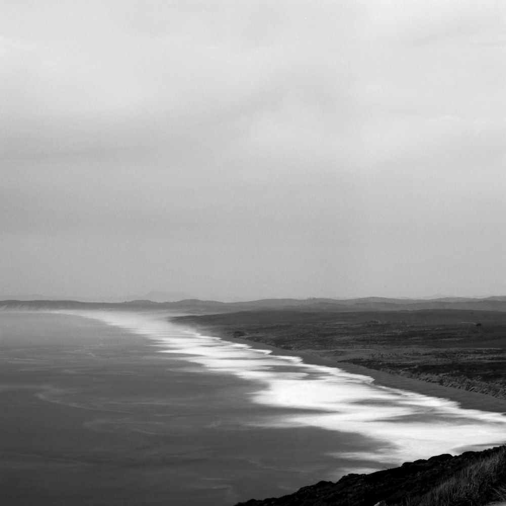 a black and white photo of a large body of water