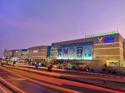 Vibrant shopping mall with colorful lights at dusk
