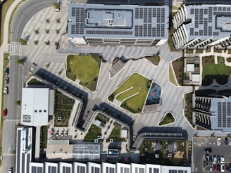 an aerial view of a parking lot and parking garages