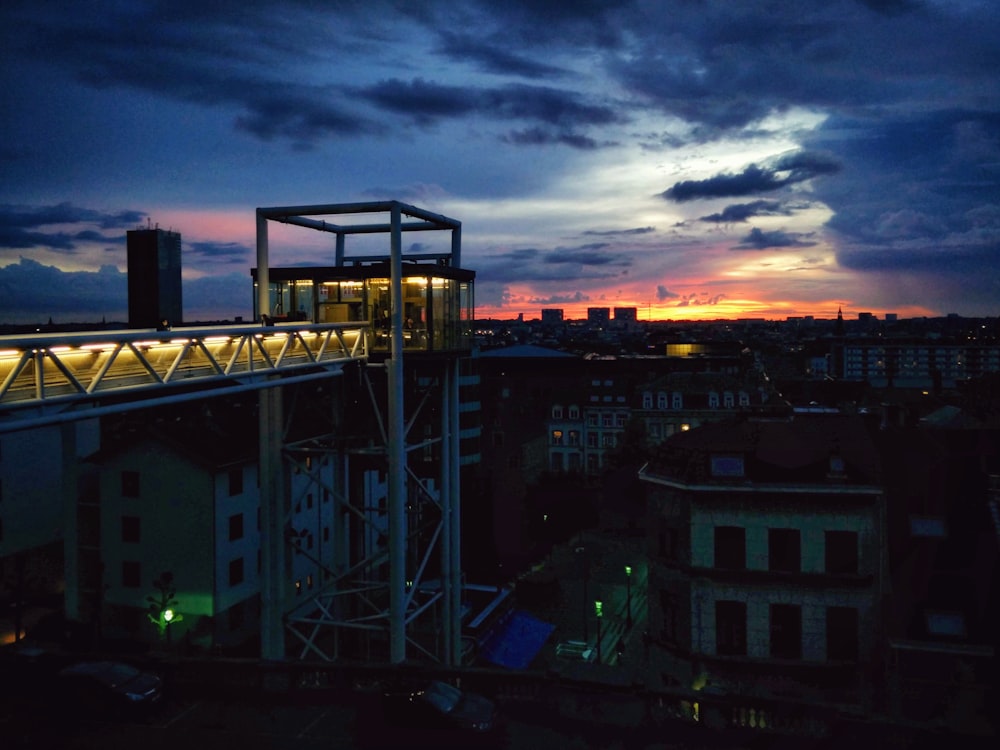 a view of a city at night from a rooftop