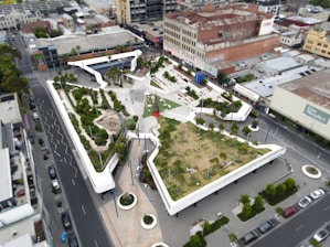 an aerial view of a building with a green roof
