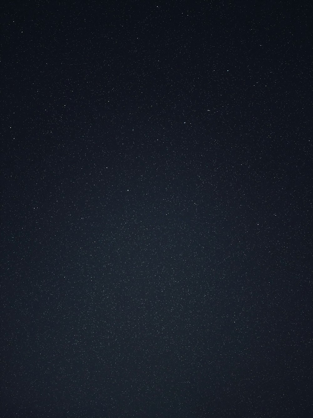 a night sky with a few stars in it