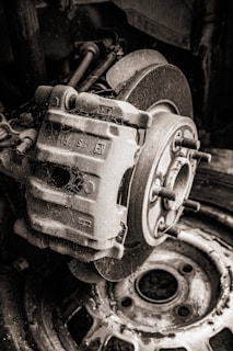 Detailed shot of a used brake caliper with some rust.