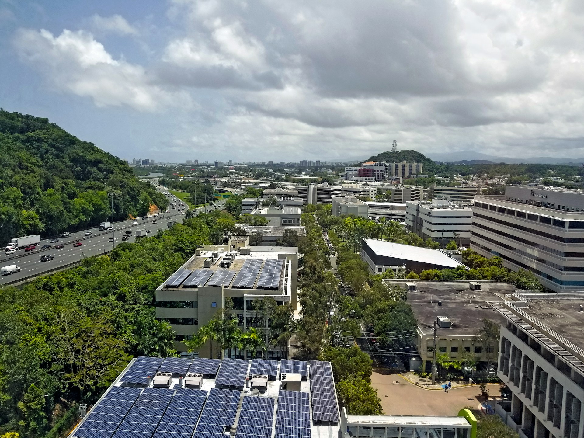 an aerial view of a city with solar panels