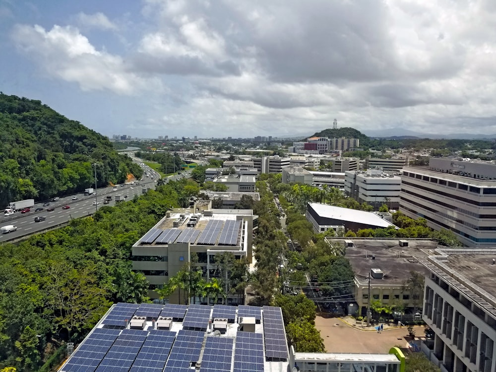 an aerial view of a city with solar panels
