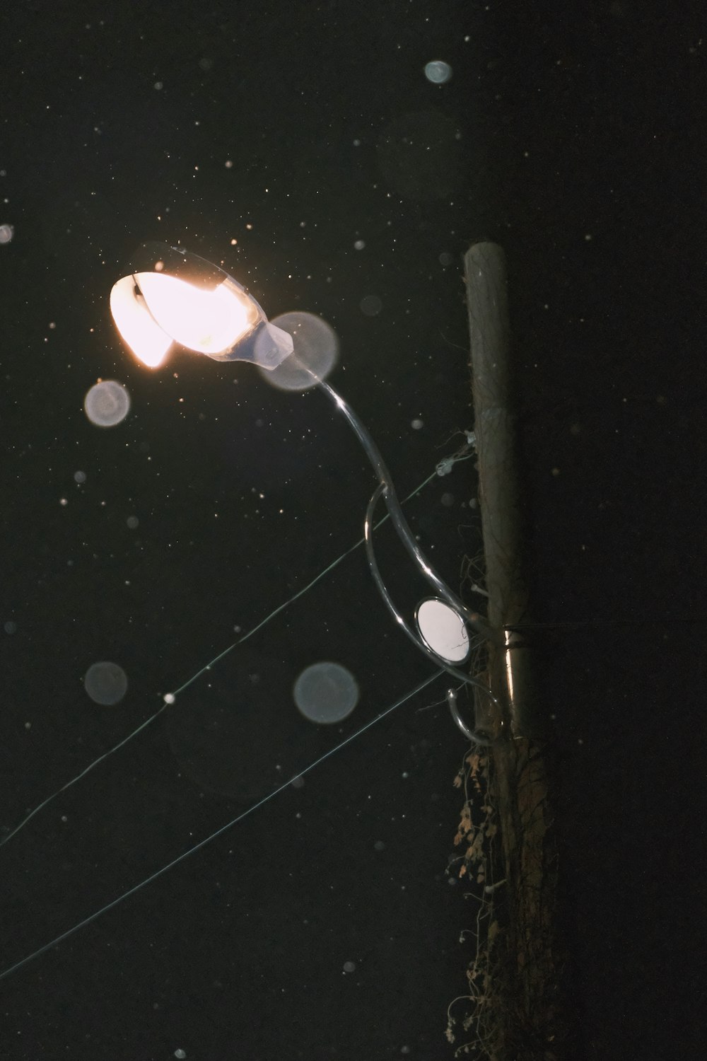 a street light on a pole in the dark