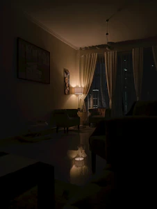 A cozy living room softly illuminated by an elegant Twilight Aura lamp casting a warm glow.