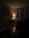 A softly lit living room with comfortable seating and warm decor accents.