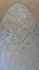 A textured surface features a central atom symbol surrounded by various scientific and technological icons, including a beaker, robotic arm, drone, recycling symbol, and a leaf.