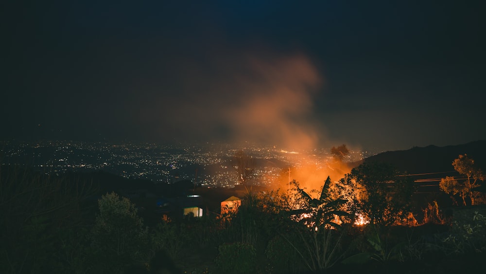 a view of a city from a hill at night