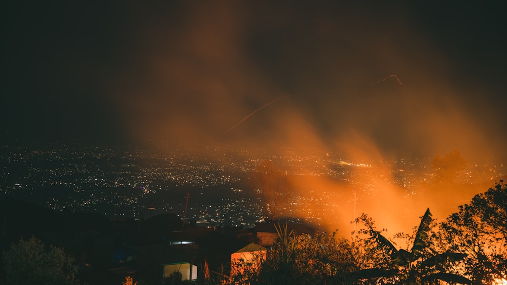 a view of a city from a hill at night