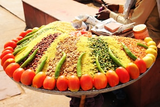 a large platter of various vegetables and grains