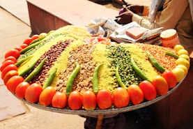 a large platter of various vegetables and grains