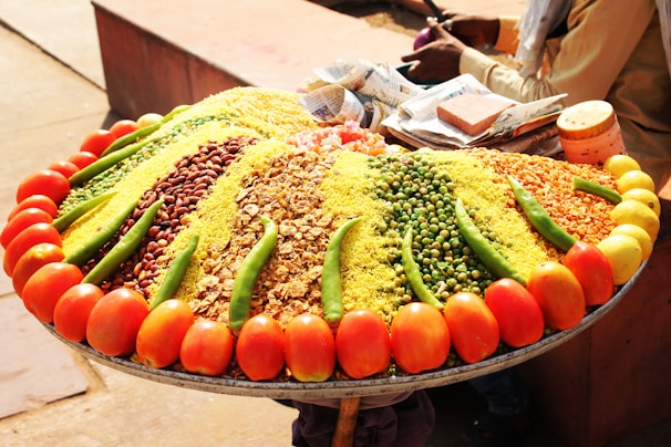 a large platter of various vegetables and grains